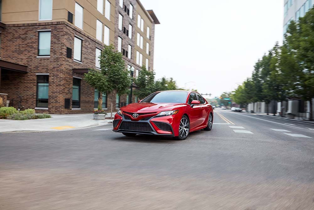 Why drivers should consider an extended warranty on their Toyota at Bobby Rahal Toyota | 2021 Toyota Camry making a turn at an intersection