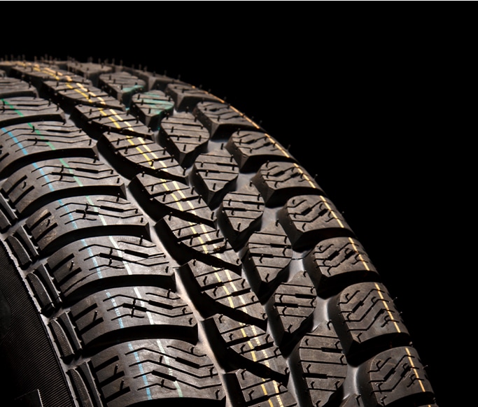 How to Get Your Car Summer Ready at Bobby Rahal Toyota in Mechanicsburg, PA | Detail shot of new tire threads with a black background