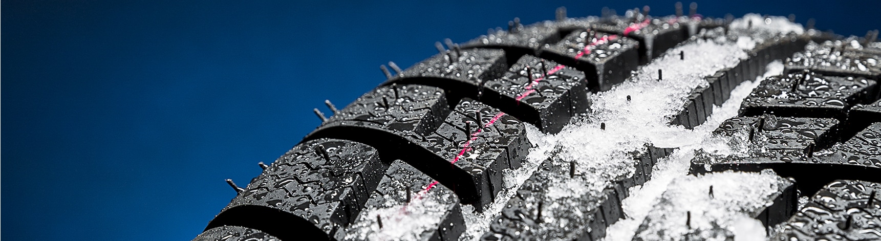 The Cold Facts of Winter Tires | Bobby Rahal Toyota in Mechanicsburg, PA | Close up of winter tires with snow melting on top of the tire