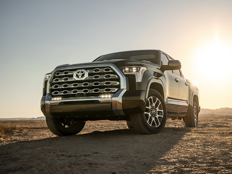 The 2022 Toyota Tundra vs. The 2021 Toyota Tundra at Bobby Rahal Toyota | Black 2022 Toyota Tundra Driving Uphill Dirt Road