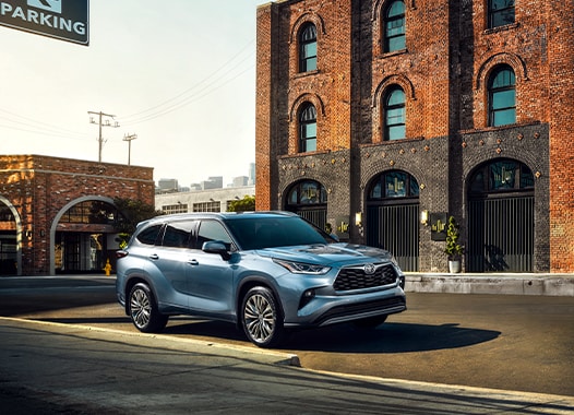 Model Features of the 2021 Toyota Highlander at Bobby Rahal Toyota | Highlander parked in downtown area