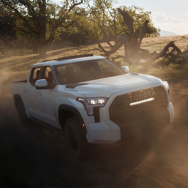 The 2022 Toyota Tundra vs. The 2021 Toyota Tundra at Bobby Rahal Toyota | White 2022 Toyota Tundra TRD Pro Offroading on Dusty Desert Trail
