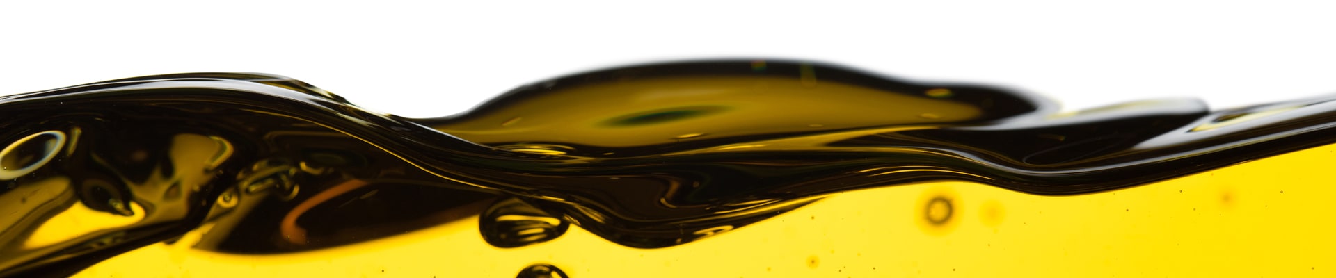 Difference between synthetic oil & conventional oil at Bobby Rahal Toyota | Eye Level Photo of Motor Oil Creating a Film at the Surface