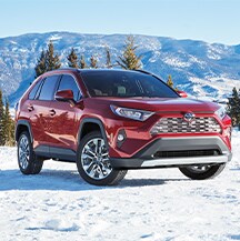 Model Features of the 2021 Toyota RAV4 at Bobby Rahal Toyota | RAV4 parked on snowy hill