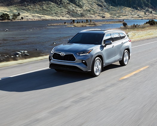 Model Features of the 2021 Toyota Highlander at Bobby Rahal Toyota | Highlander riving next to river