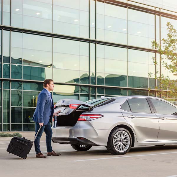 Model Features of the 2022 Toyota Camry at Bobby Rahal Toyota | Business Man Opening Trunk on 2022 Toyota Camry