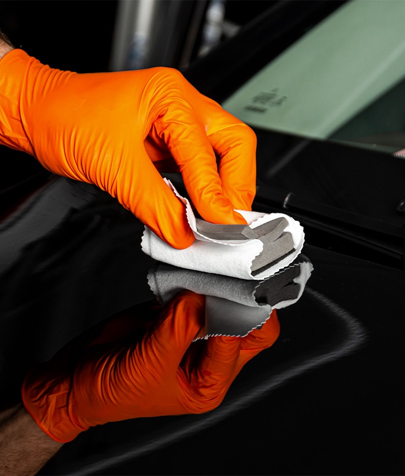 Accessories that help keep your Toyota protected at Bobby Rahal Toyota in Mechanicsburg, PA | Service Advisor Polishing Exterior of Vehicle