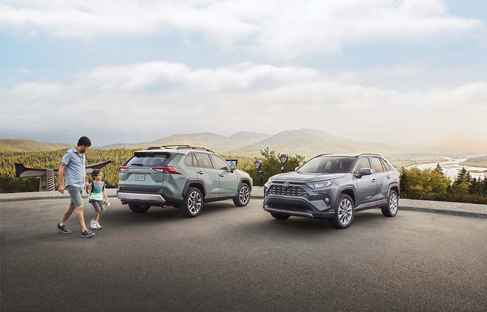 Why drivers should consider an extended warranty on their Toyota at Bobby Rahal Toyota | Two 2021 Toyota RAV4s parked at an overlook