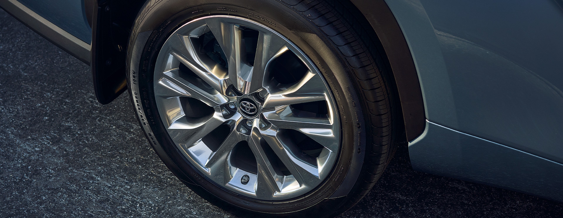 Accessories that help keep your Toyota protected at Bobby Rahal Toyota in Mechanicsburg, PA | Close-Up Shot of Wheel on Blue Toyota Highlander