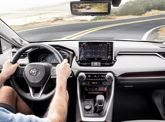Compare the 2021 Toyota RAV4 vs. the 2021 Subaru Forester at Bobby Rahal Toyota of Mechanicsburg | Driving view on beach road