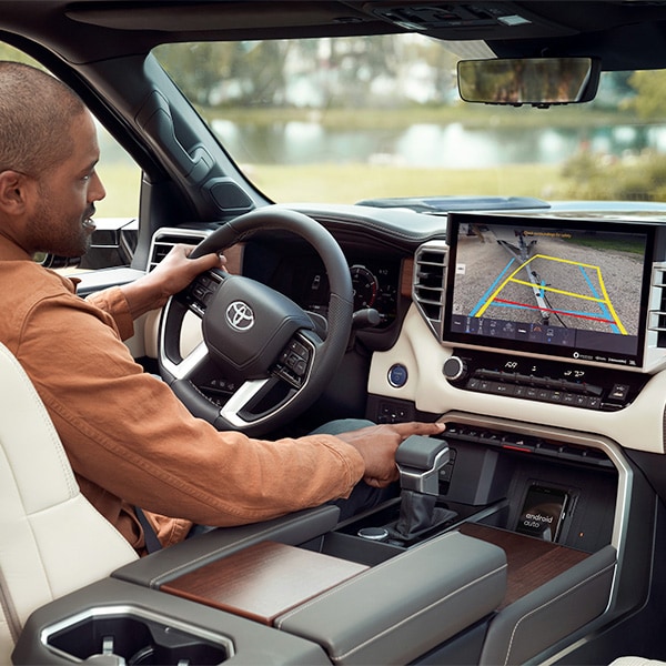 The 2022 Toyota Tundra vs. The 2021 Toyota Tundra at Bobby Rahal Toyota | Interior of the 2022 Toyota Tundra Featuring Infotainment System Displaying Back-Up Camera