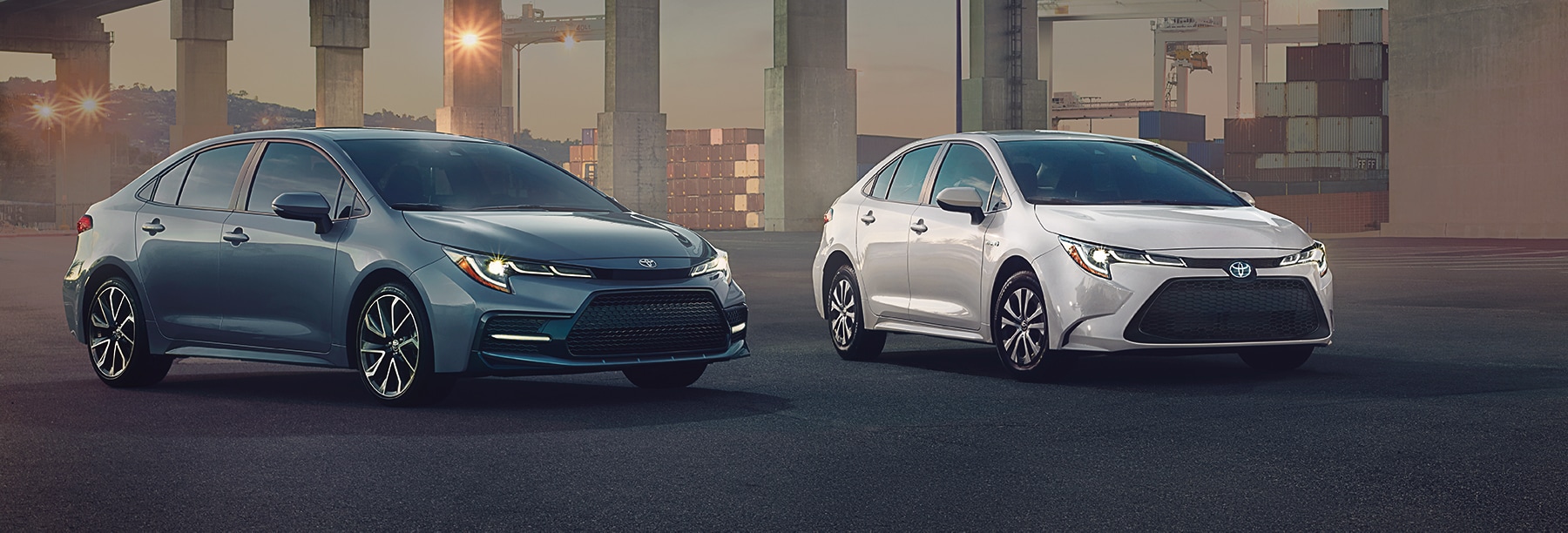Compare the 2020 Honda Civic Sedan vs. the 2020 Toyota Corolla at Bobby Rahal Toyota of Lewistown | White and grey 2020 Corolla parked on street
