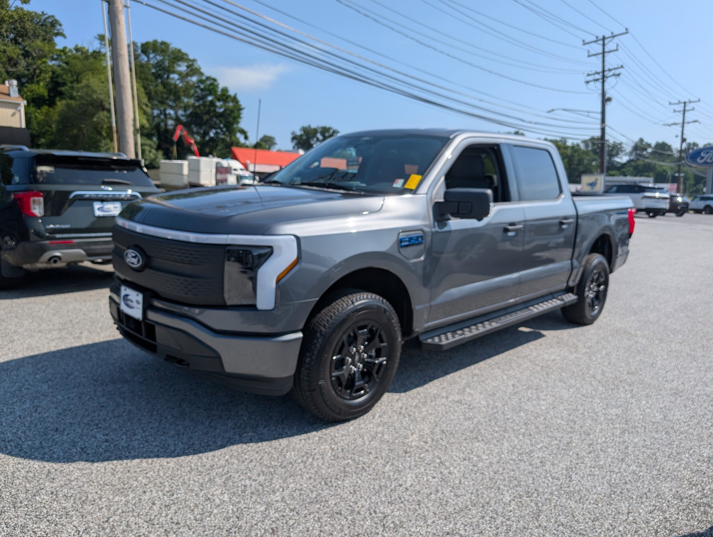 Certified 2025 Ford F-150 Lightning XLT with VIN 1FTVW3LK5SWG09281 for sale in Parkville, MD