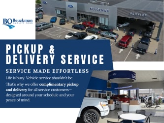  Exterior shot of man in front of house with a white Explorer® SUV cell phone in hand