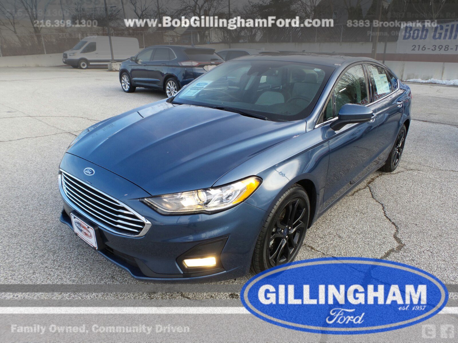 pre-owned navy blue ford sedan