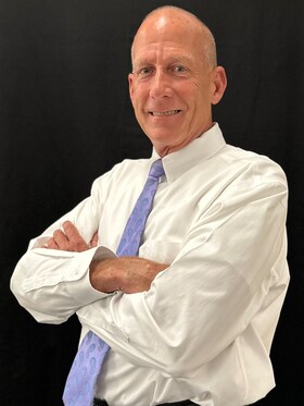 Staff member Arnie Romaldini from 02c7f146cd9c