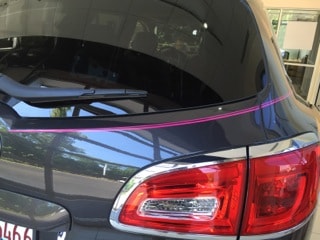 Susan G. Komen For The Cure Pinstriping on rear of car