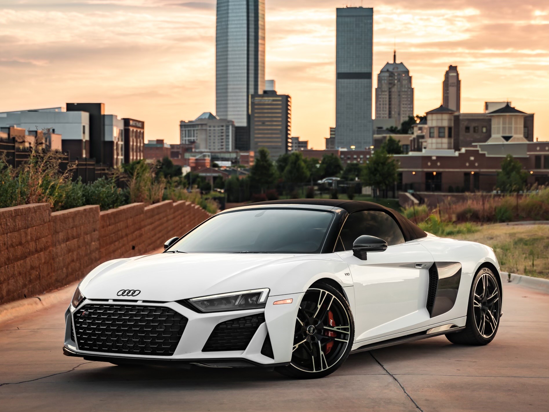2023 White Audi R8 V10 supercar parked in vacant parking lot near Audi Oklahoma City