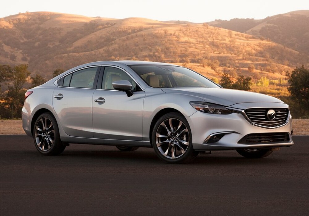 Silver 2016 Mazda6 sedan shown at sunset by mountains in Colorado Springs