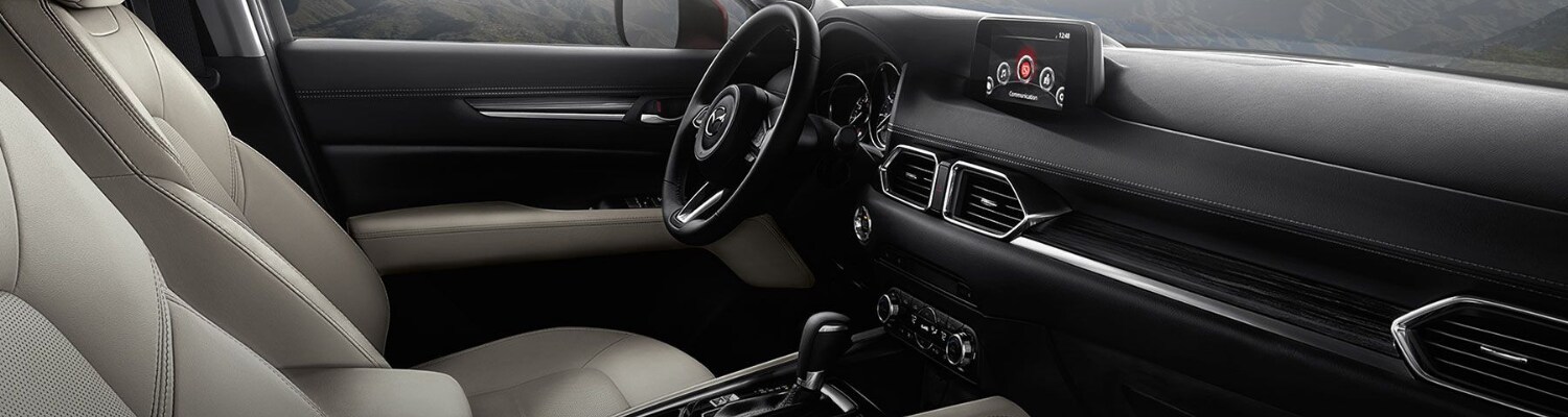 Interior view of a 2018 Mazda CX-5 from the front passenger side door