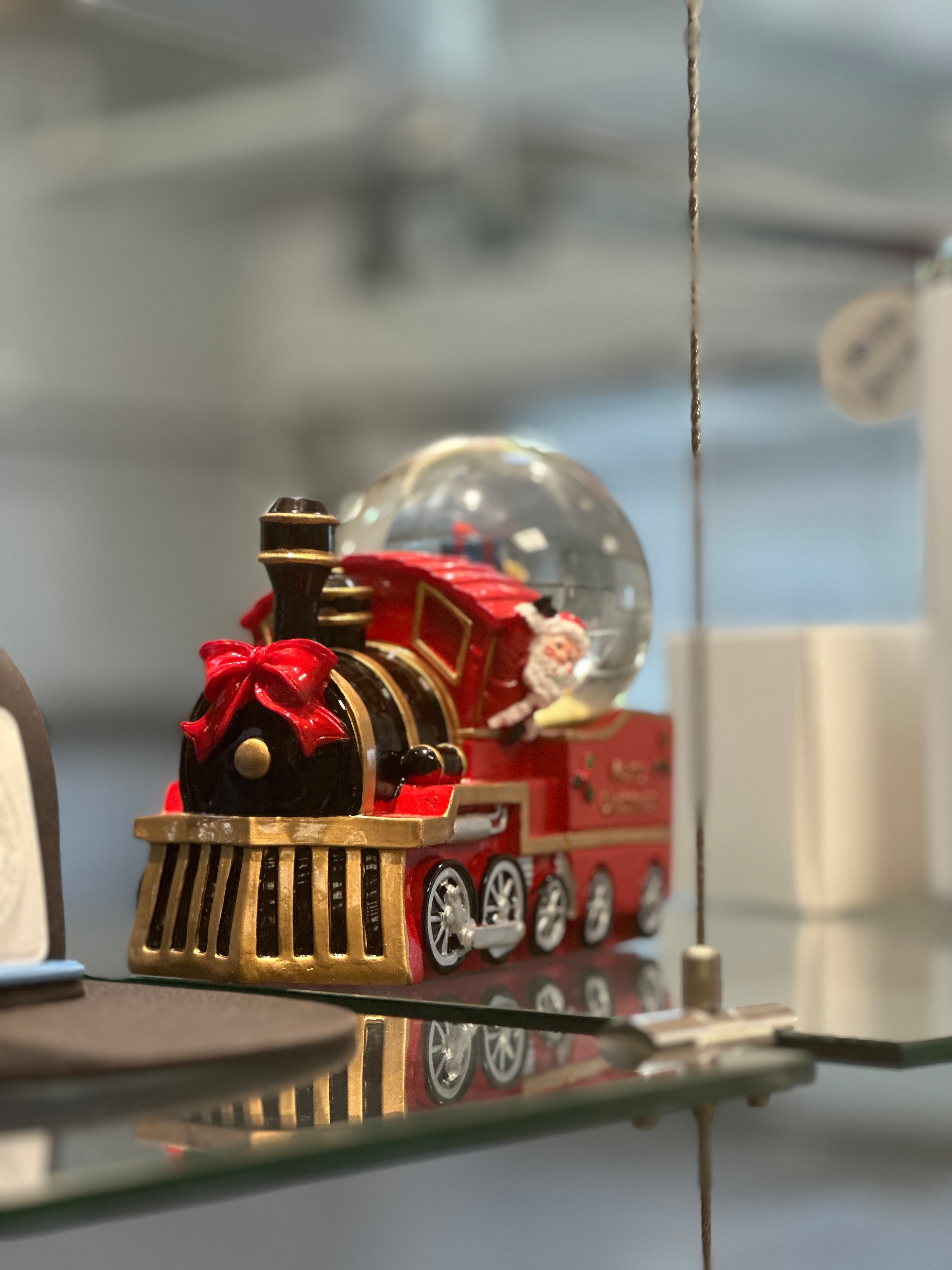 Red holiday train with Santa in Mercedes-Benz boutique