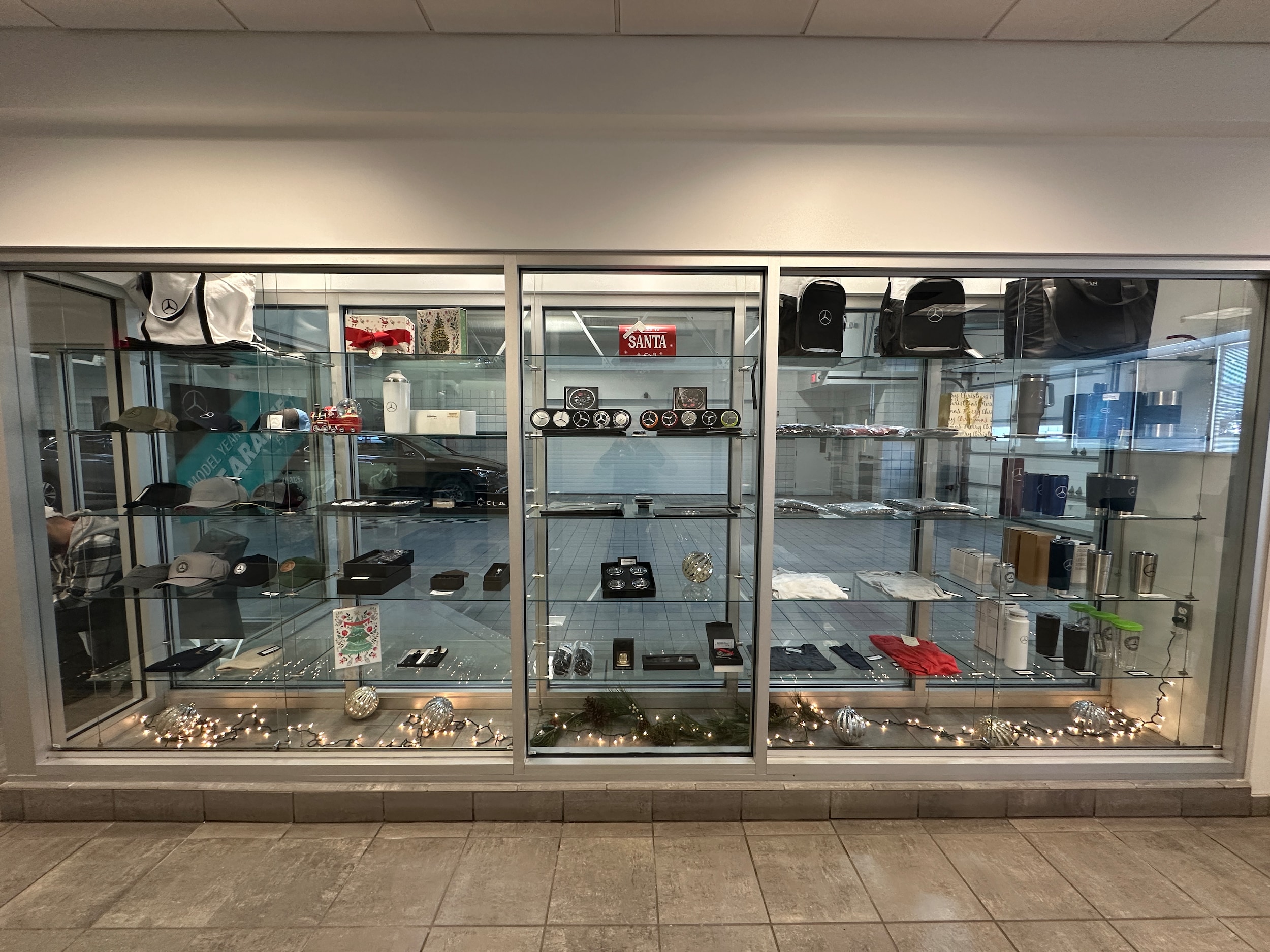 Light blue golf polos and Titleist golf balls in Mercedes-Benz boutique