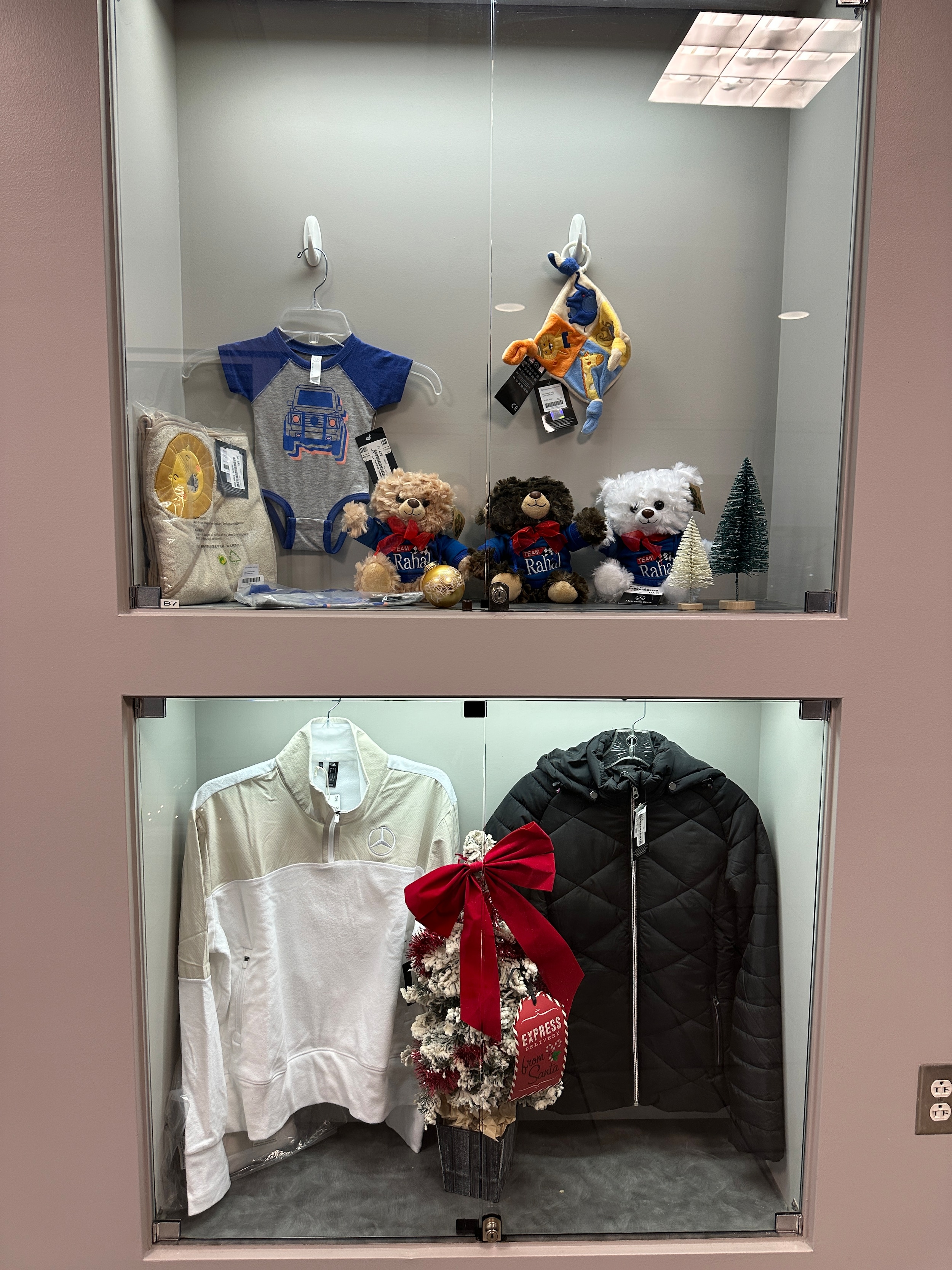 Mercedes-Benz vests and quarter zip with holiday gift boxes