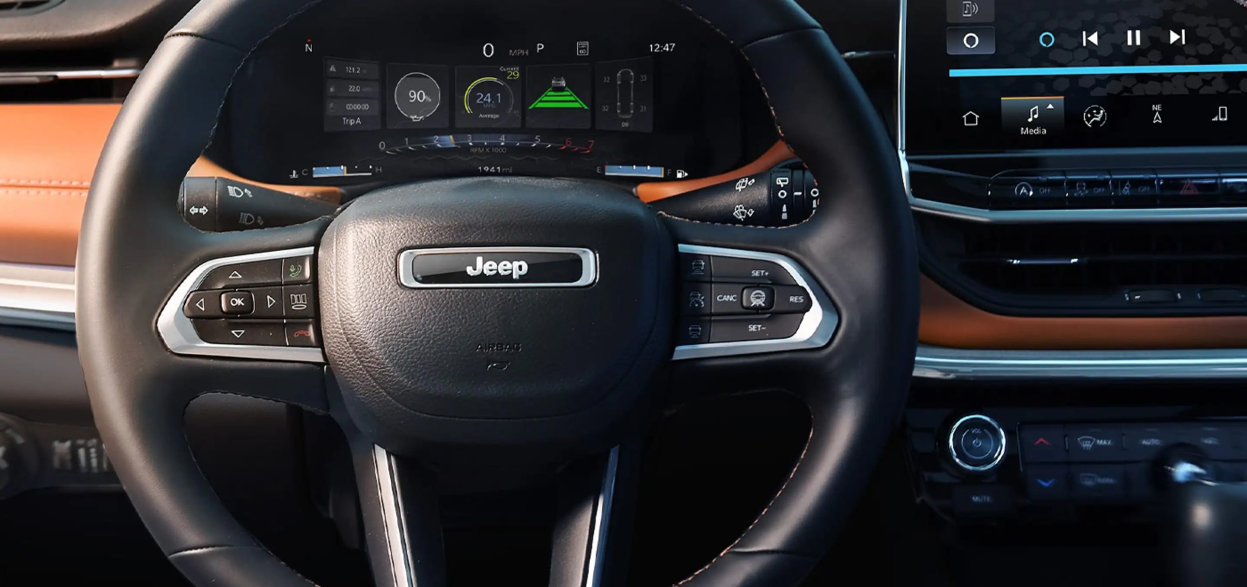 Steering wheel of the 2025 Jeep Compass near Orange