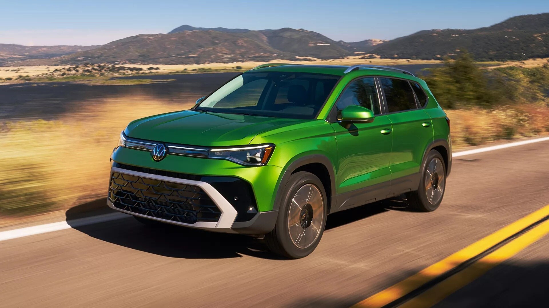 2026 Volkswagen Taos driving near Alexandria