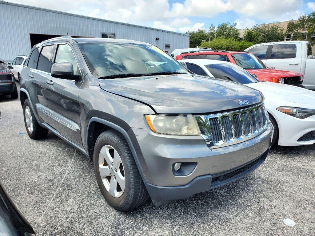 Used 2012 Jeep Grand Cherokee Laredo with VIN 1C4RJEAG8CC142404 for sale in Miami, FL