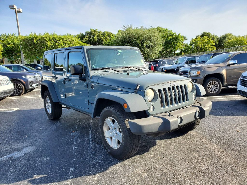 Used 2014 Jeep Wrangler Unlimited Sport with VIN 1C4BJWDG0EL251672 for sale in Miami, FL