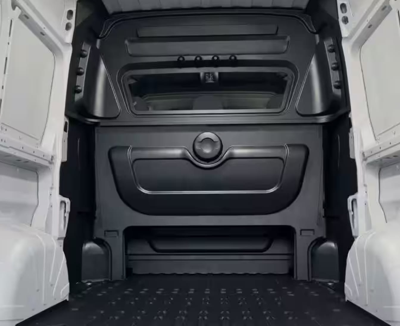 2026 RAM ProMaster 2500 interior cargo space of a van, with white paneled walls and a textured black floor.