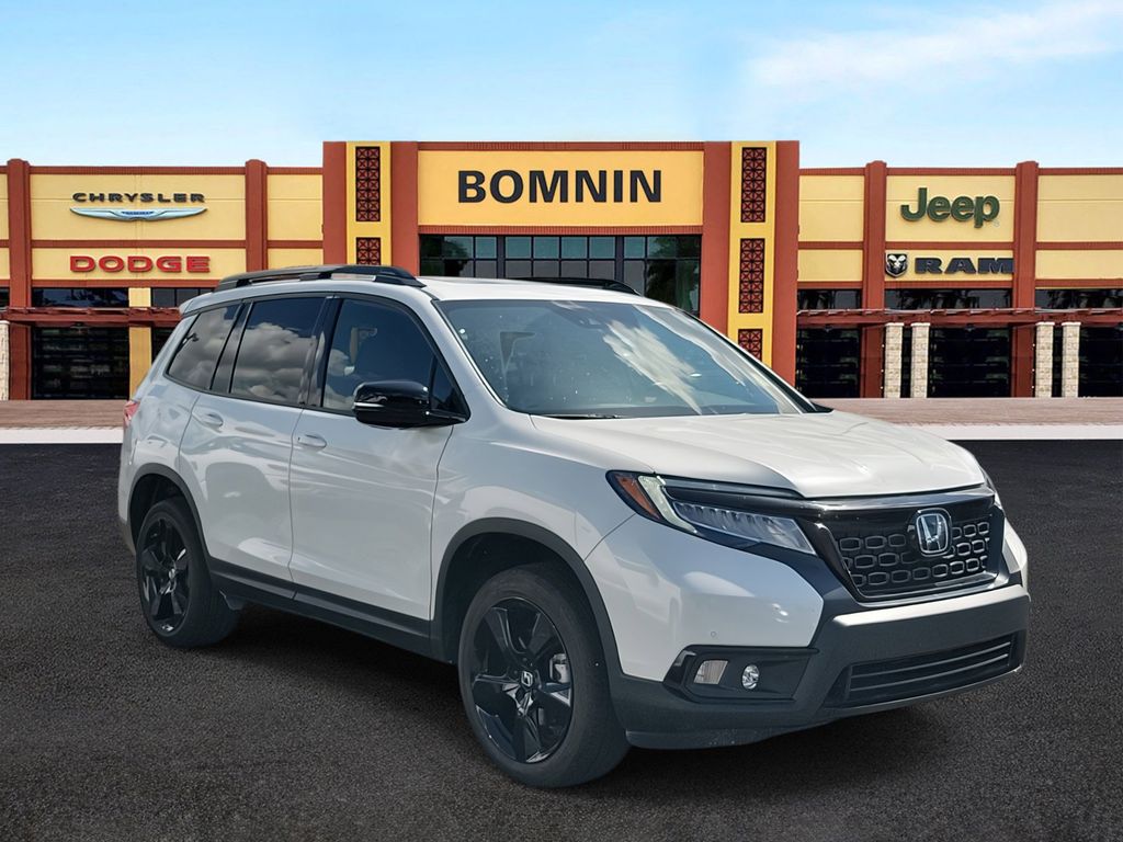 Used 2021 Honda Passport Elite with VIN 5FNYF8H03MB034381 for sale in Miami, FL