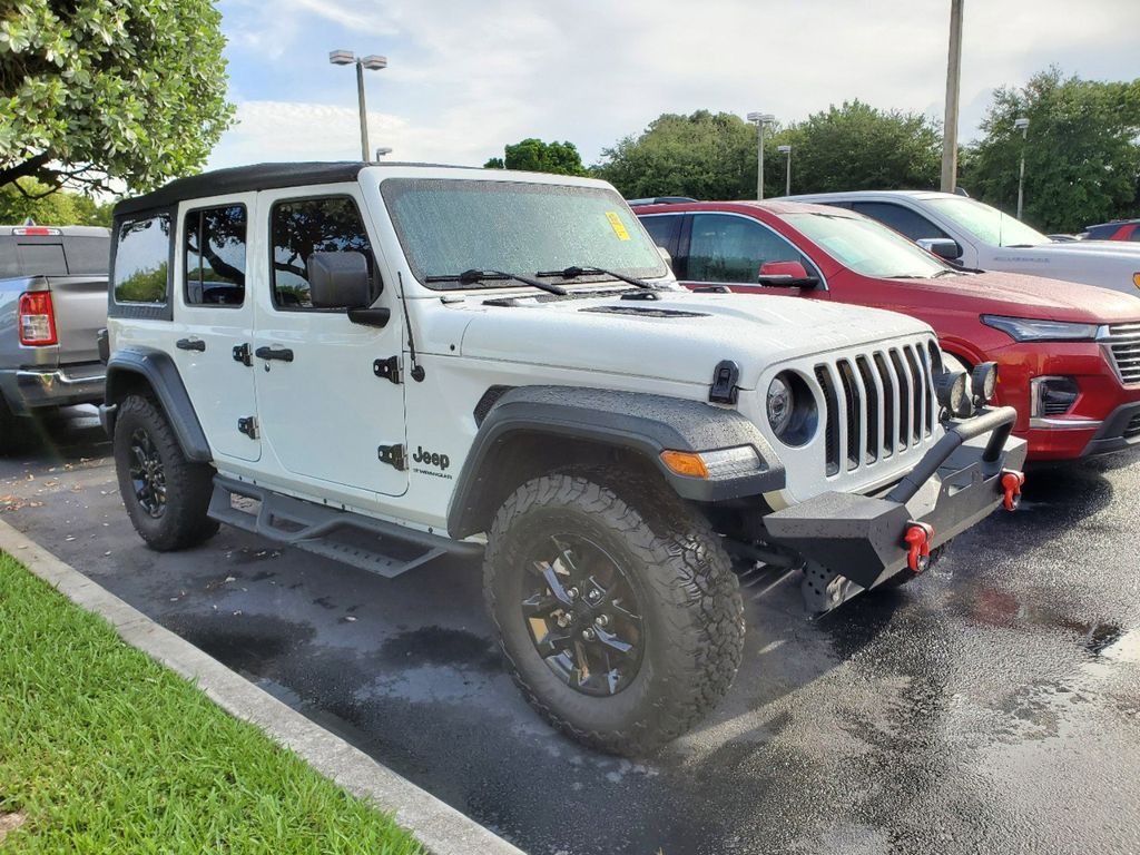 Used 2023 Jeep Wrangler 4-Door Sport with VIN 1C4HJXDG8PW659869 for sale in Miami, FL