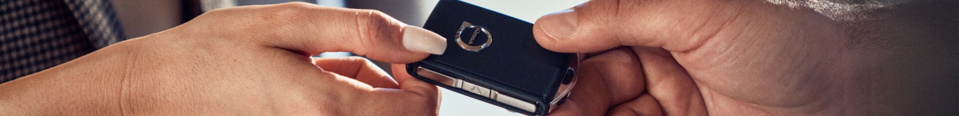 Volvo key fob being handed off