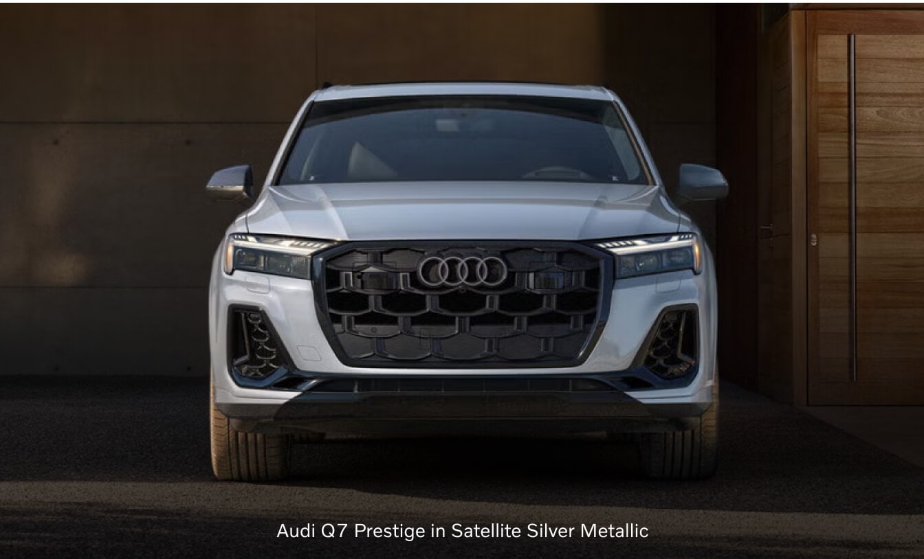 2026 Audi Q7 Prestige showcasing its front grille parked under a modern carport.