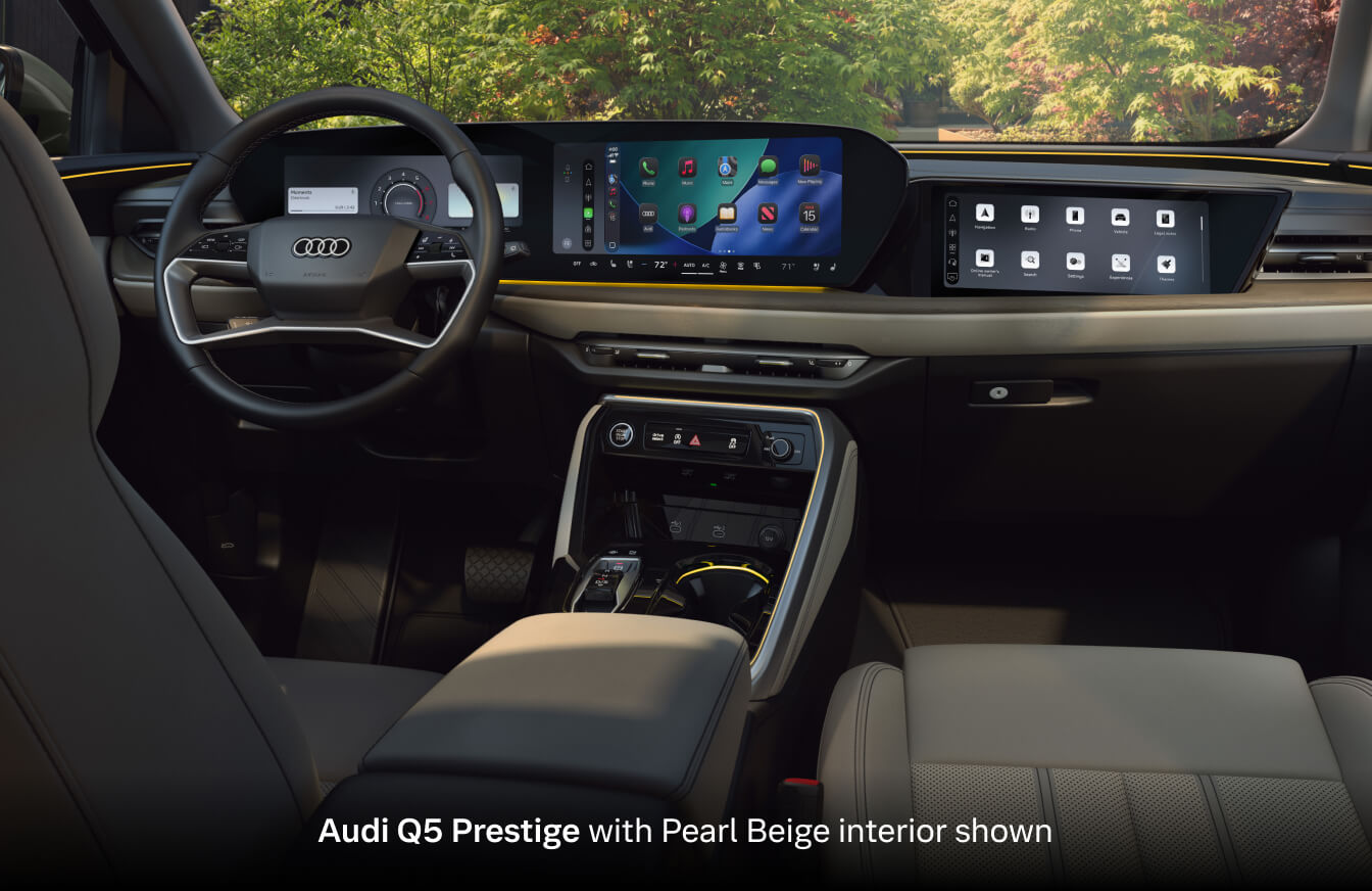 2026 Audi Q5 Prestige with Pearl Beige interior, showing panoramic displays, steering wheel and center console.