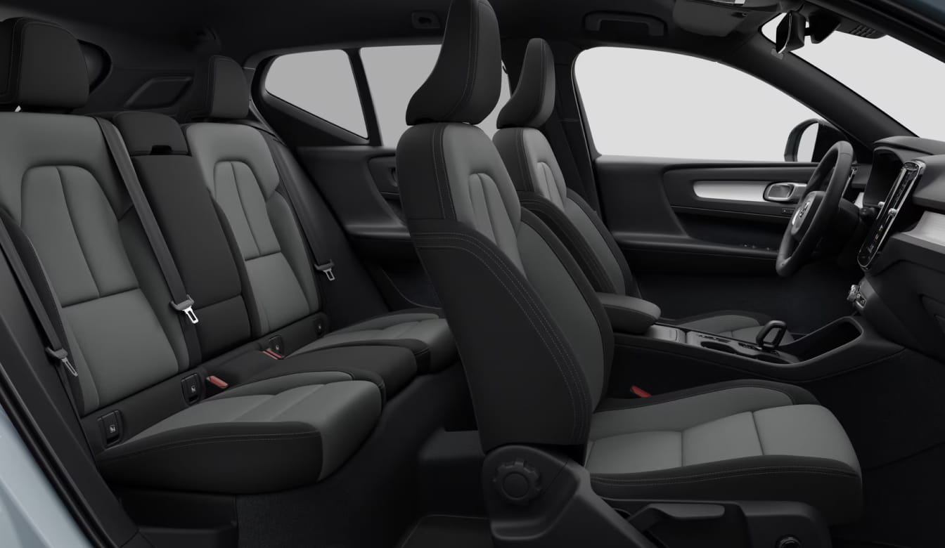 Volvo XC40 interior with black and gray seating for five and a view of the front cabin.