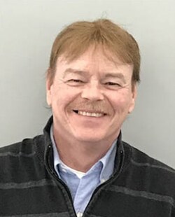 Staff member Mr. Tim Schofield from 54c330b30837