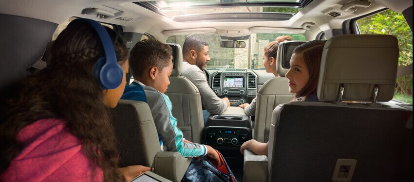A photo of a family seated inside the spacious New 2018 Ford Expedition