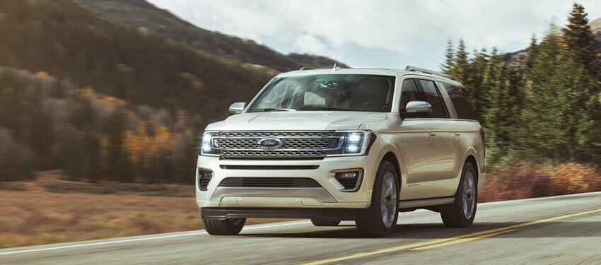 Photo of the 2018 Ford Expedition driving down a scenic highway in West Michigan