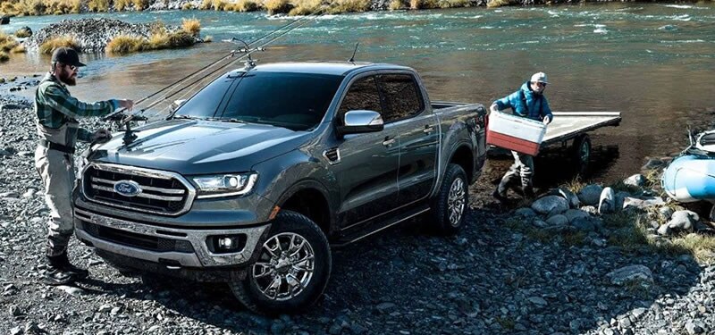Photo of two fishermen after using the New 2019 Ford Ranger Towing System to safely bring their boat to a West MI river.