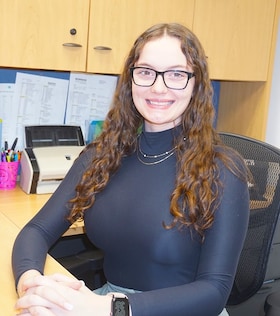 Staff member Emily Brindisi from ID_de4b9151ba3e