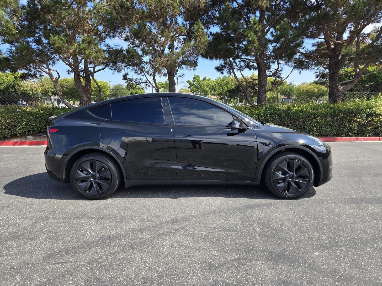 Used 2025 Tesla Model Y Long Range with VIN 7SAYGDED6SF233874 for sale in Long Beach, CA