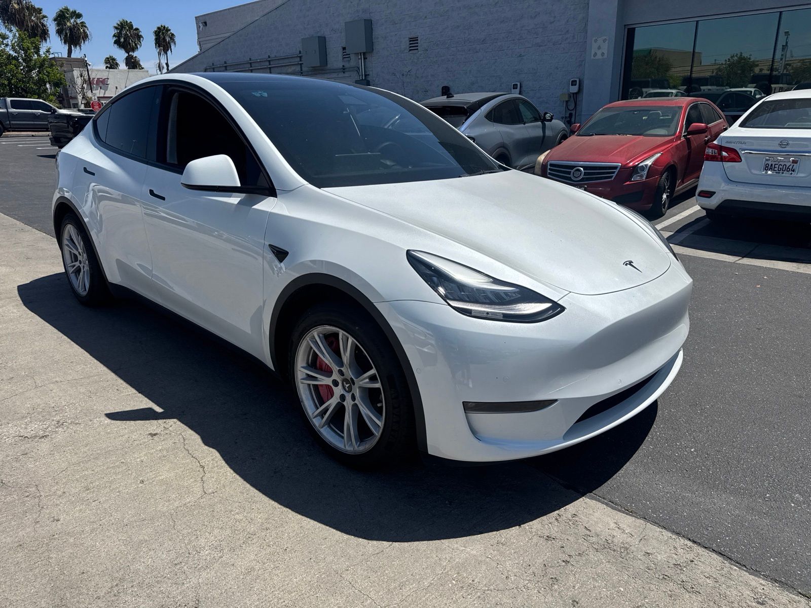 Used 2021 Tesla Model Y Standard Range with VIN 5YJYGDED9MF133817 for sale in Long Beach, CA