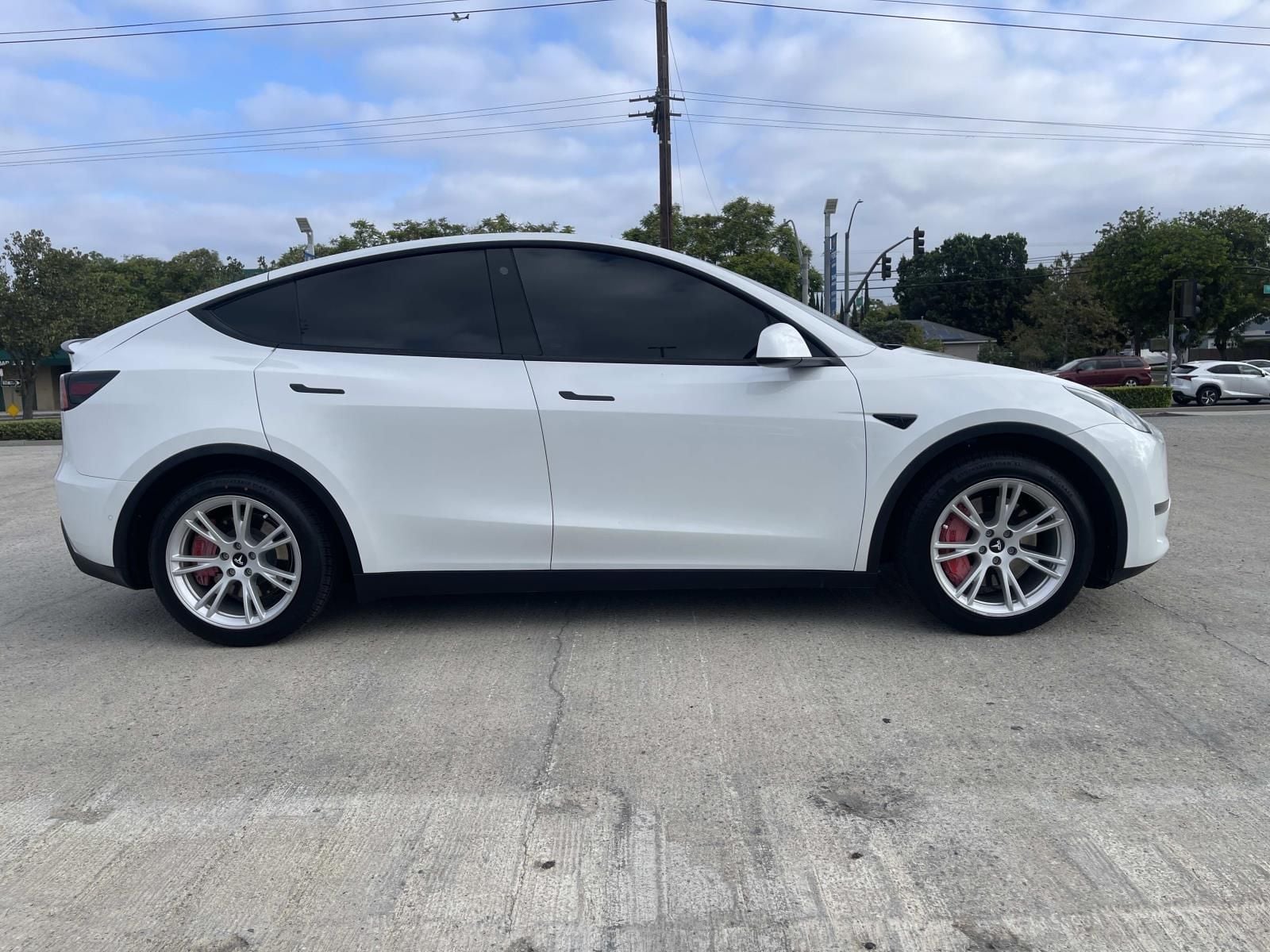 Used 2021 Tesla Model Y Standard Range with VIN 5YJYGDED9MF133817 for sale in Long Beach, CA