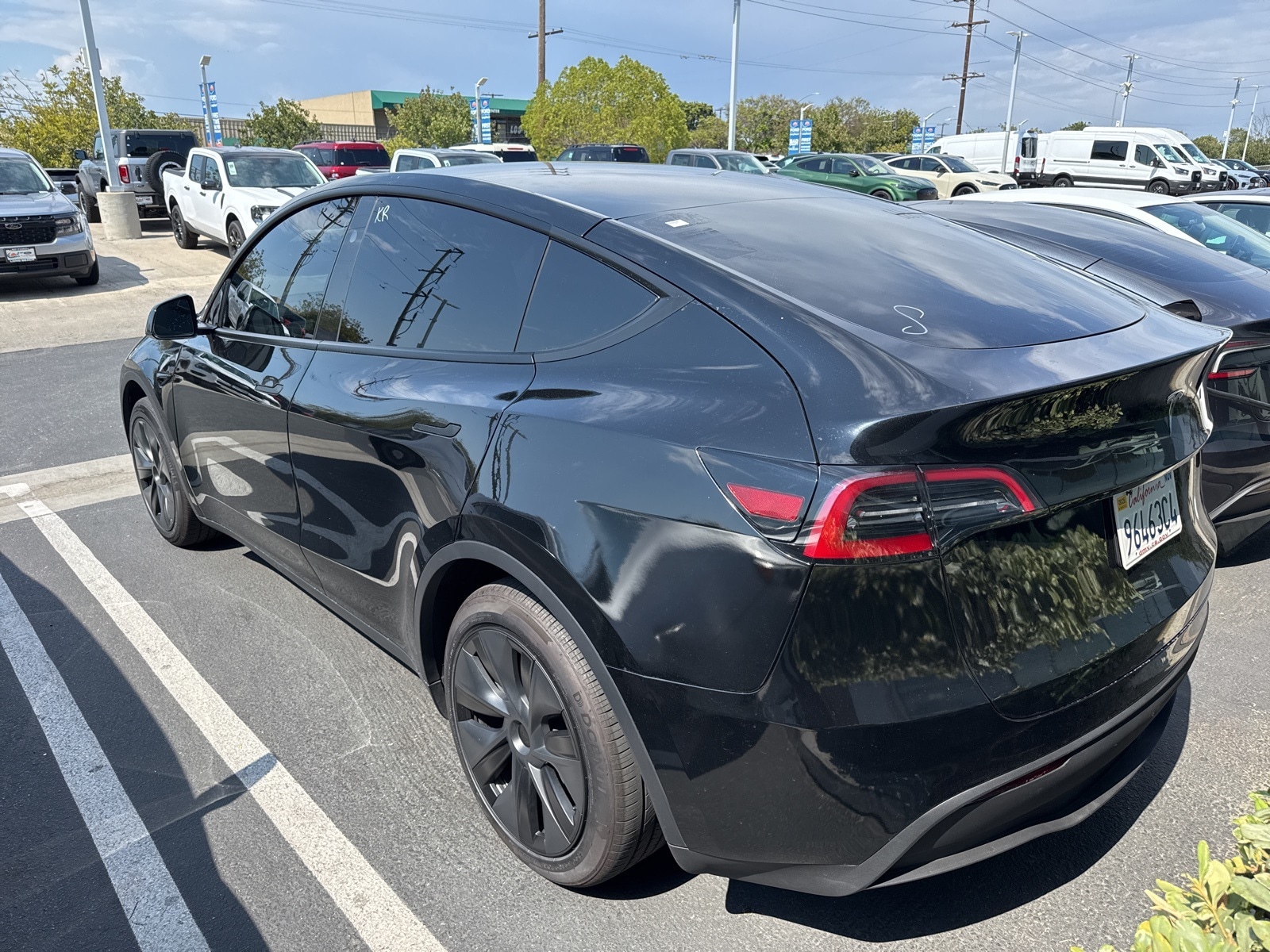 Used 2025 Tesla Model Y Long Range with VIN 7SAYGDED6SF233874 for sale in Long Beach, CA