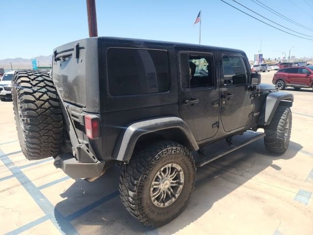 Used 2012 Jeep Wrangler Unlimited Rubicon with VIN 1C4BJWFG9CL258260 for sale in Parker, AZ
