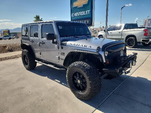 Used 2013 Jeep Wrangler Unlimited Sahara with VIN 1C4BJWEG0DL644858 for sale in Parker, AZ