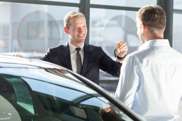 Customer Talking to Car Salesman